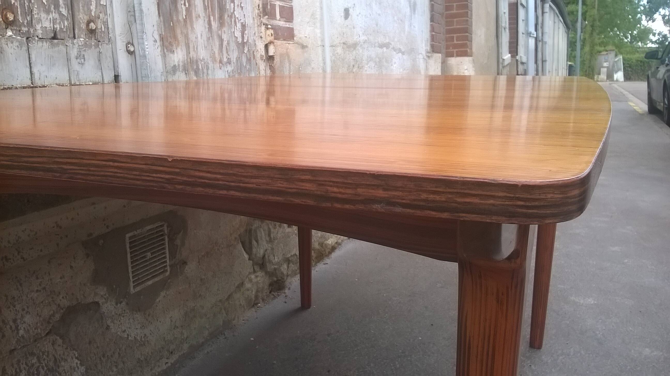 Extendable teak dining table