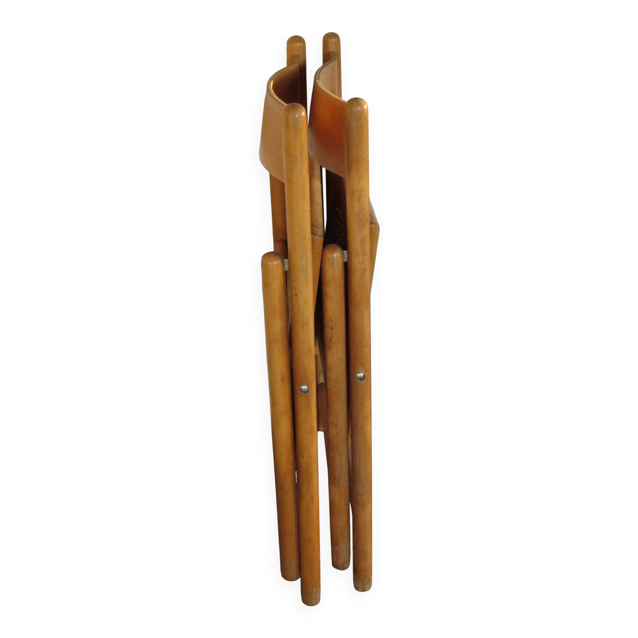 Pair of vintage wooden folding chairs with star pattern on seat