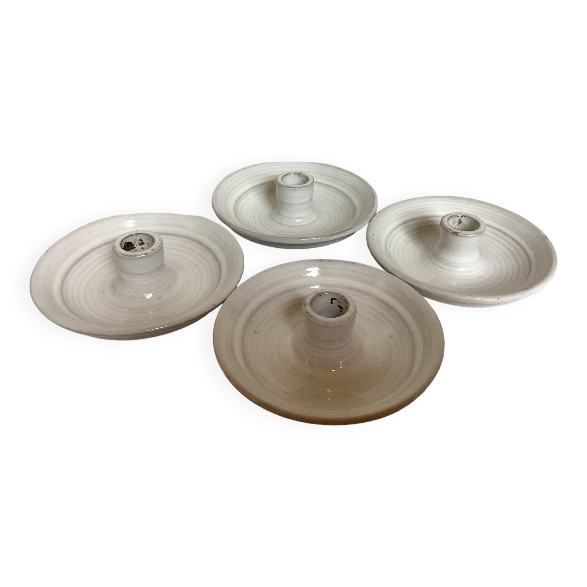 Four ceramic candle holders
