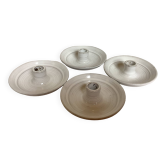 Four ceramic candle holders
