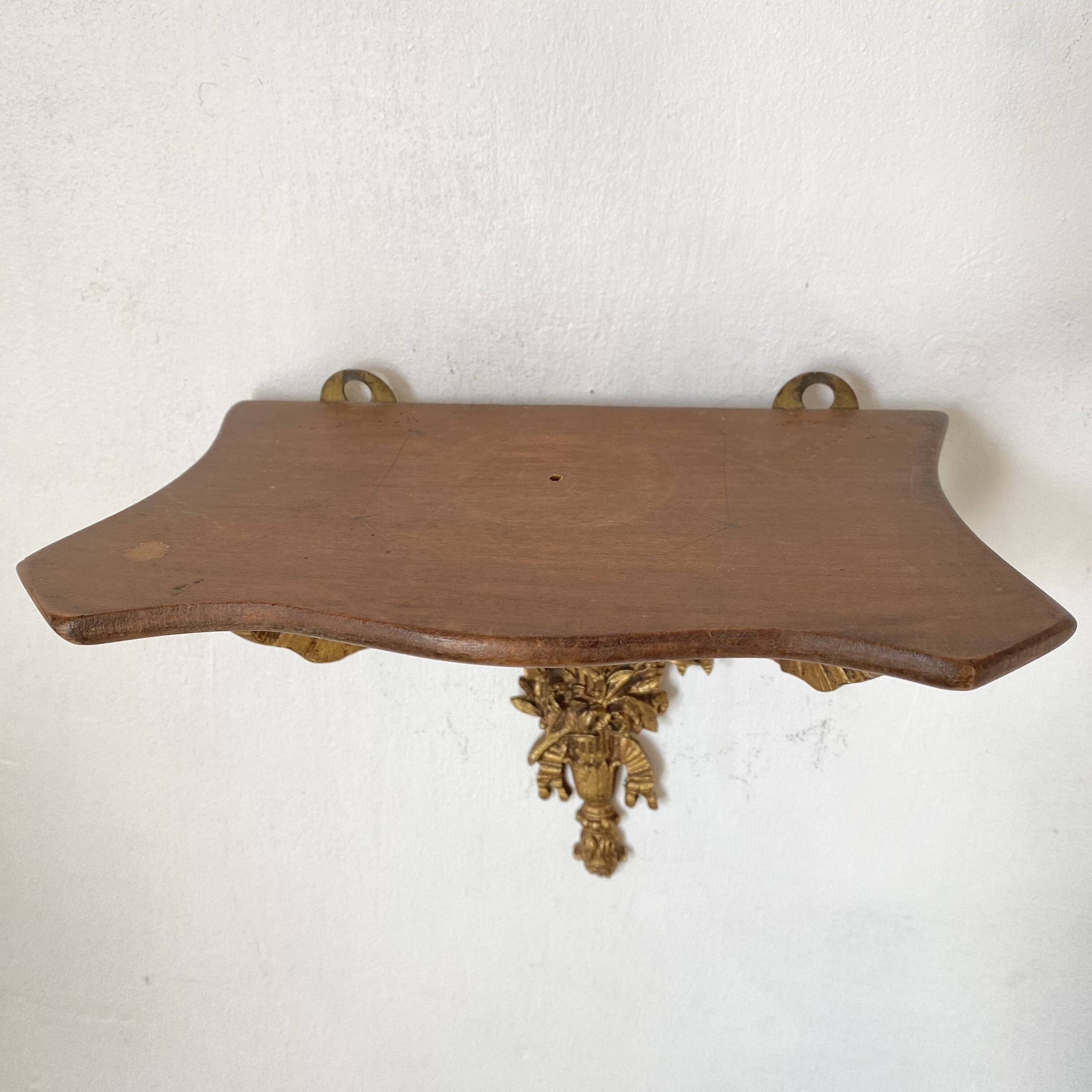 baroque shelf in wood and bronze ribbon
