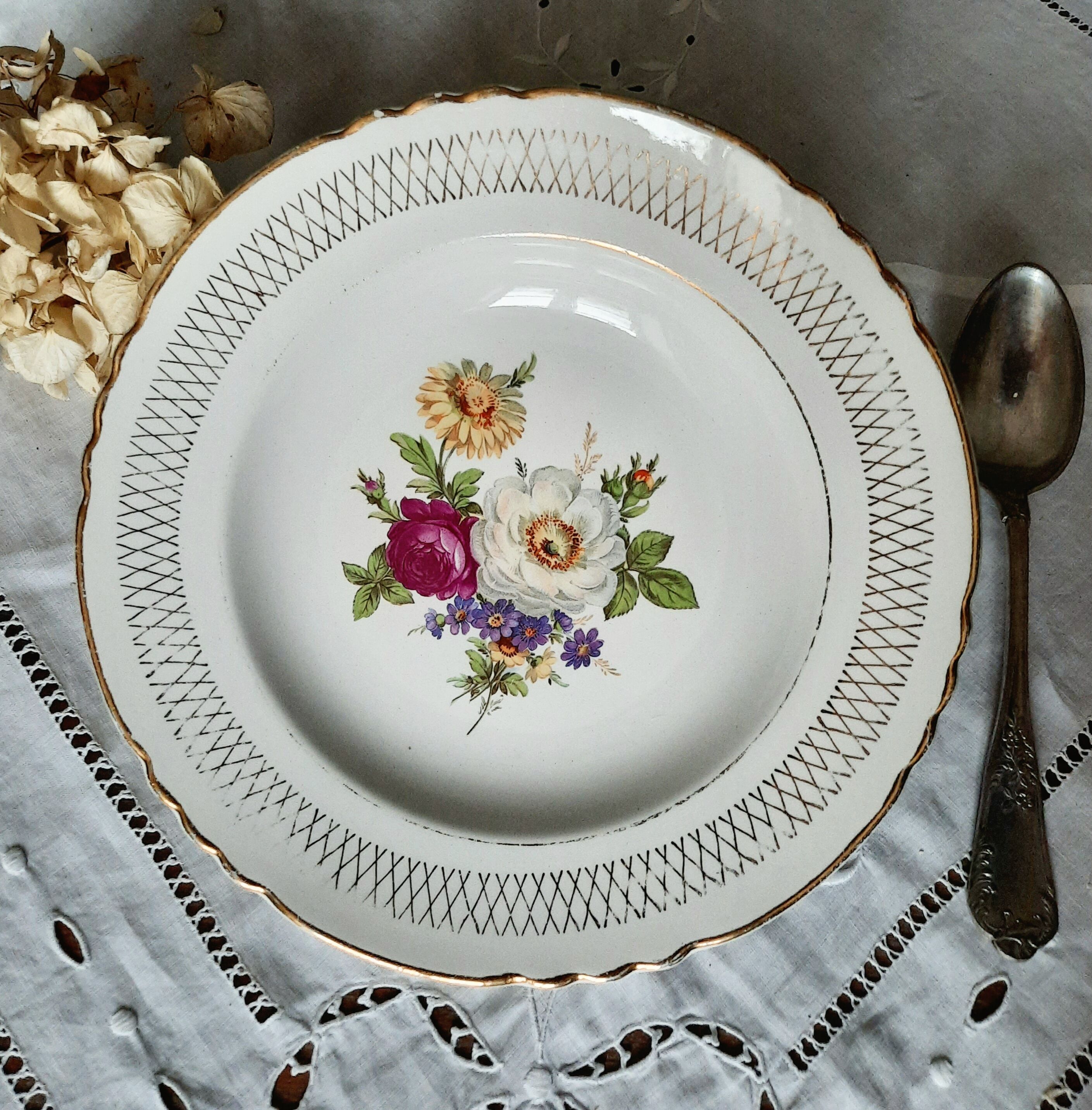 Old hollow plates mismatched in earthenware