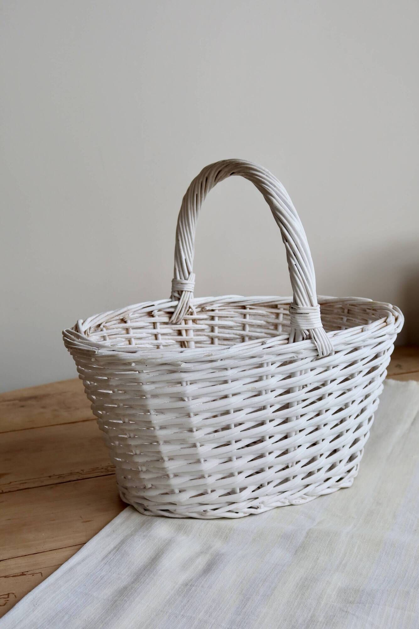 Vintage wicker basket painted white
