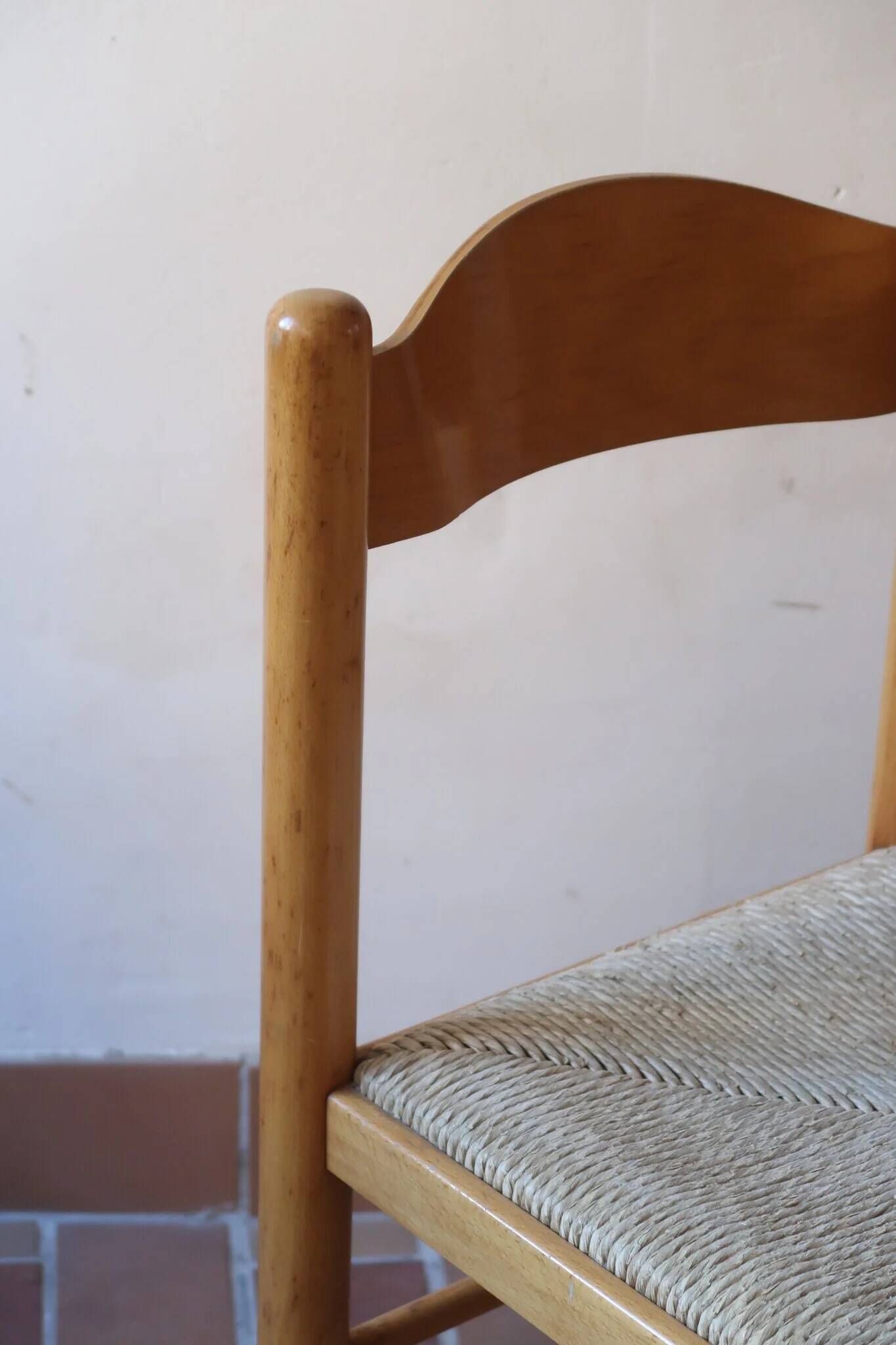 4 solid pine chairs, straw seats, shaped backrest.