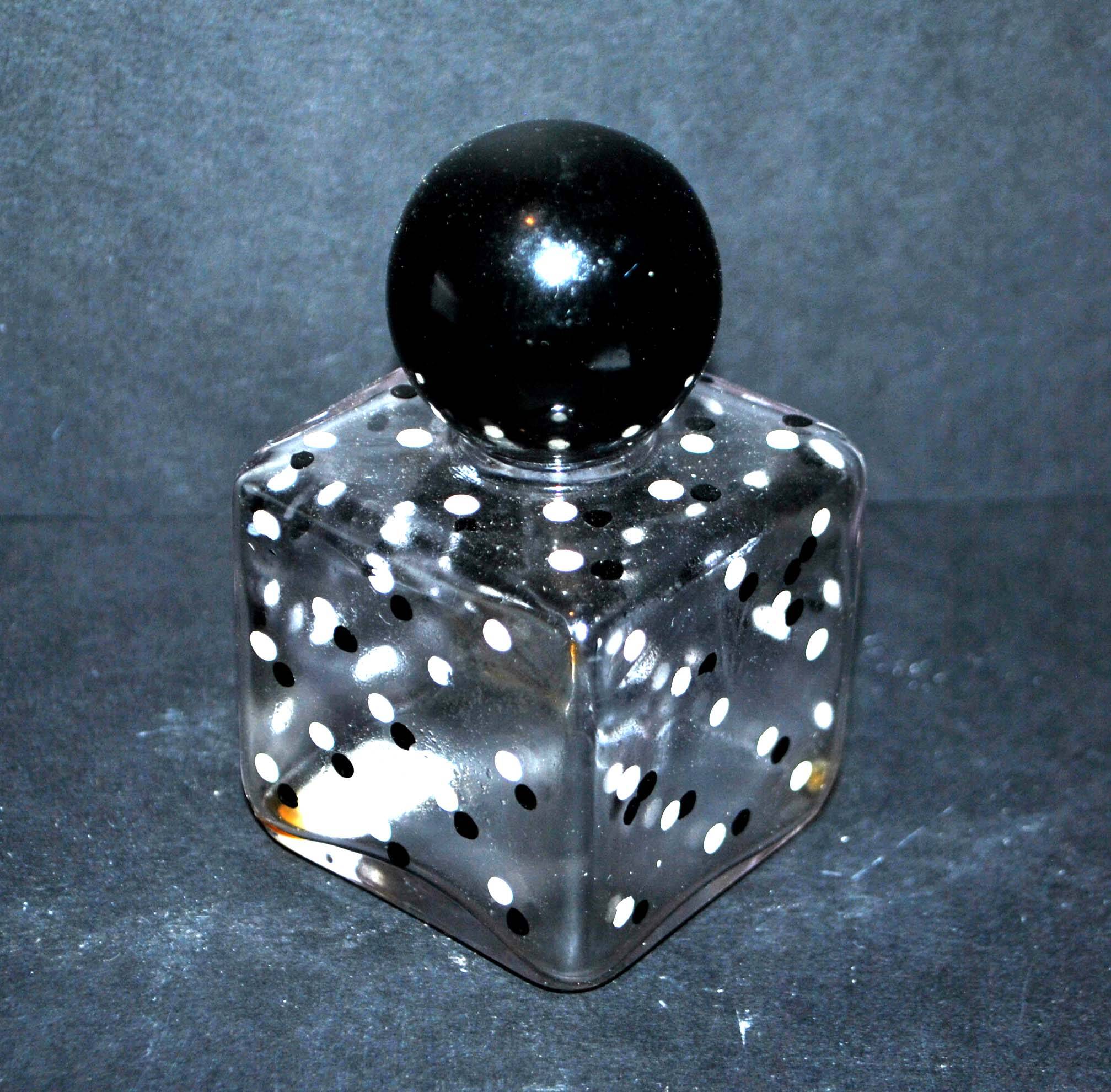 Vintage white and black polka dot glass perfume bottle and round bakelite cap