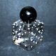 Vintage white and black polka dot glass perfume bottle and round bakelite cap