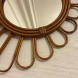 Old vintage asymmetrical round rattan mirror