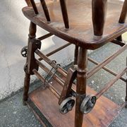 Wooden baby high chair convertible into a small desk from the 1950s