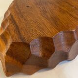 Carved wooden pocket emptier