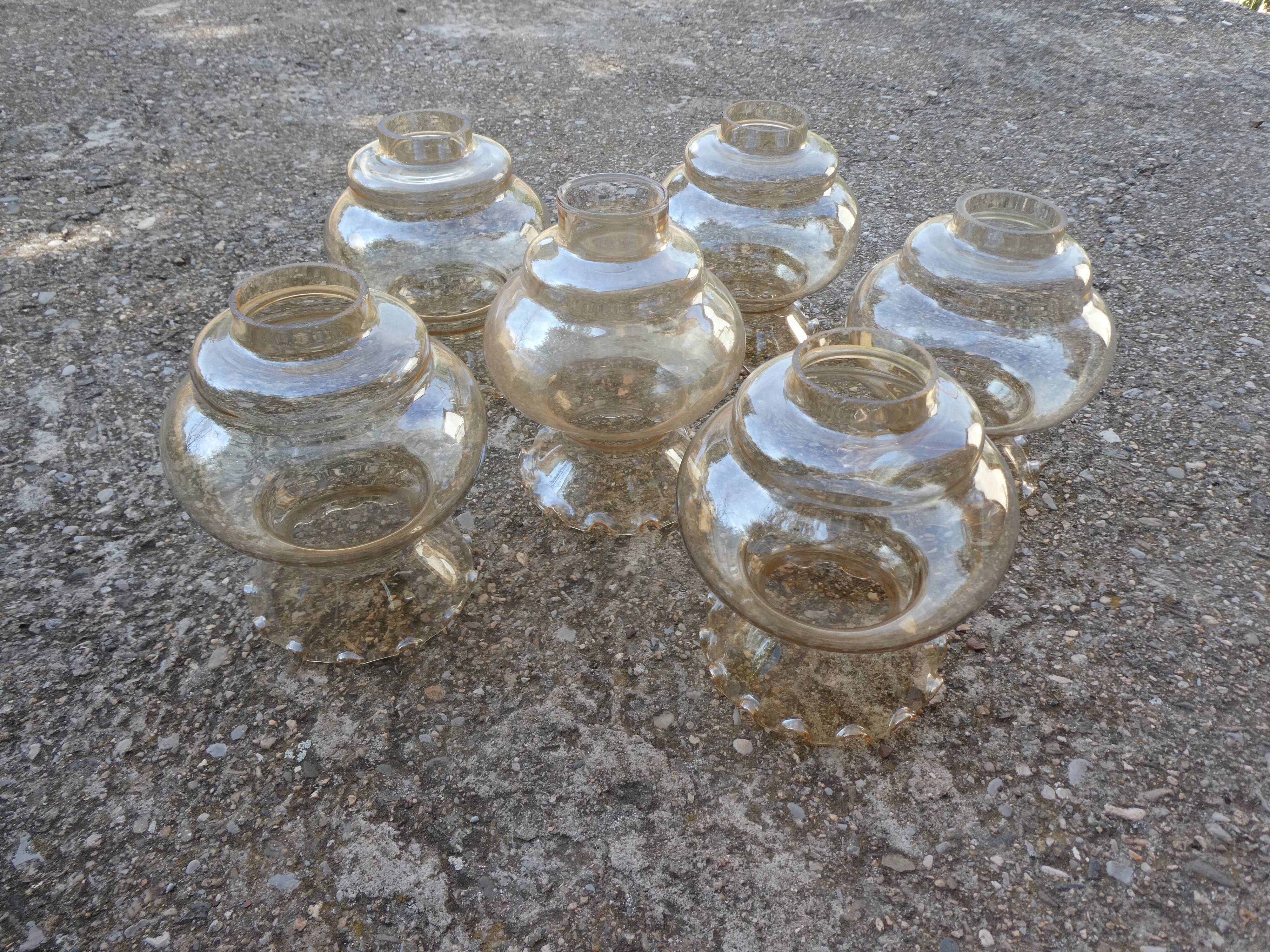 Set of 6 amber glass globes.