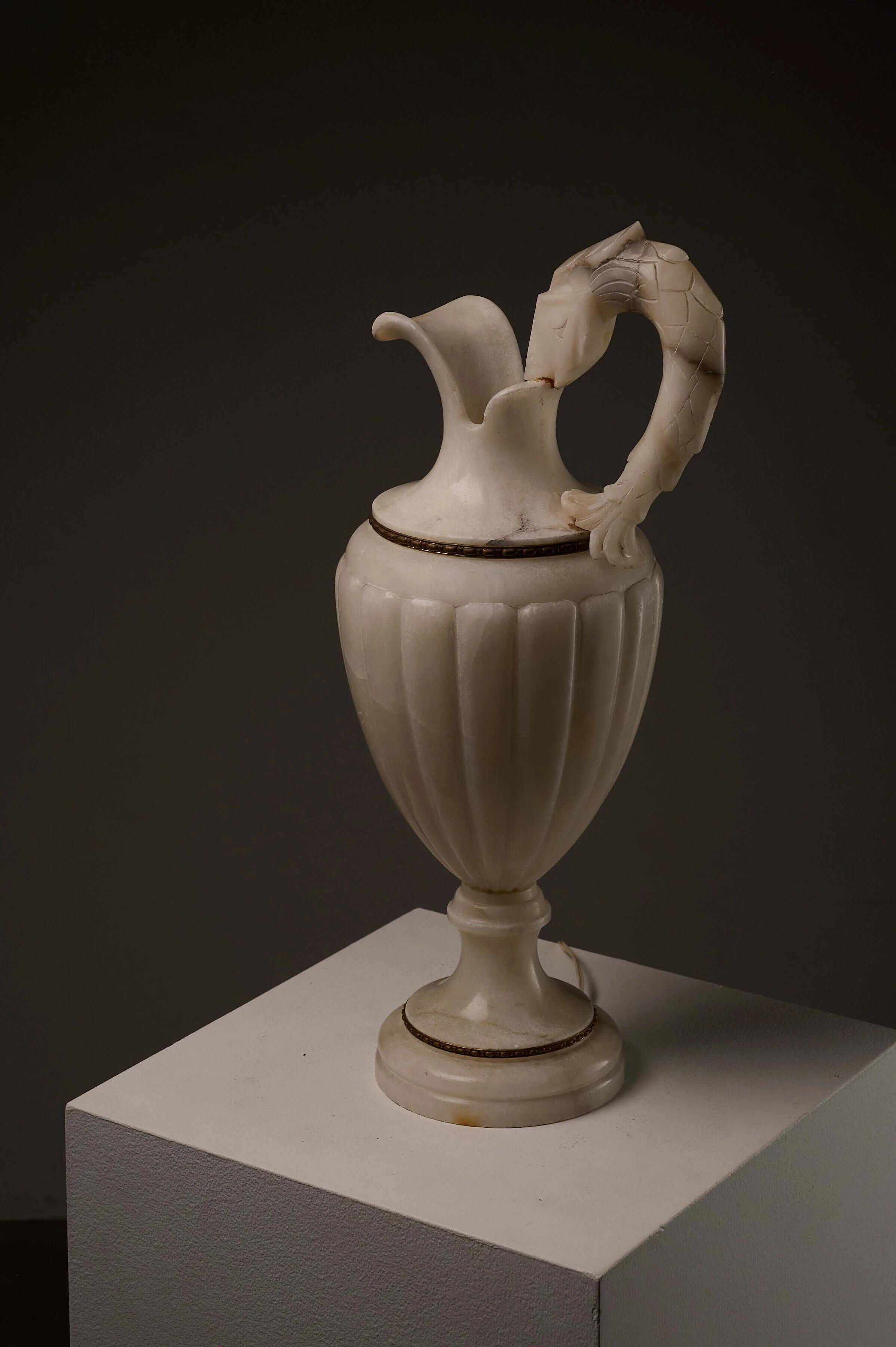 Carved alabaster urn lamp with stylized fish handle