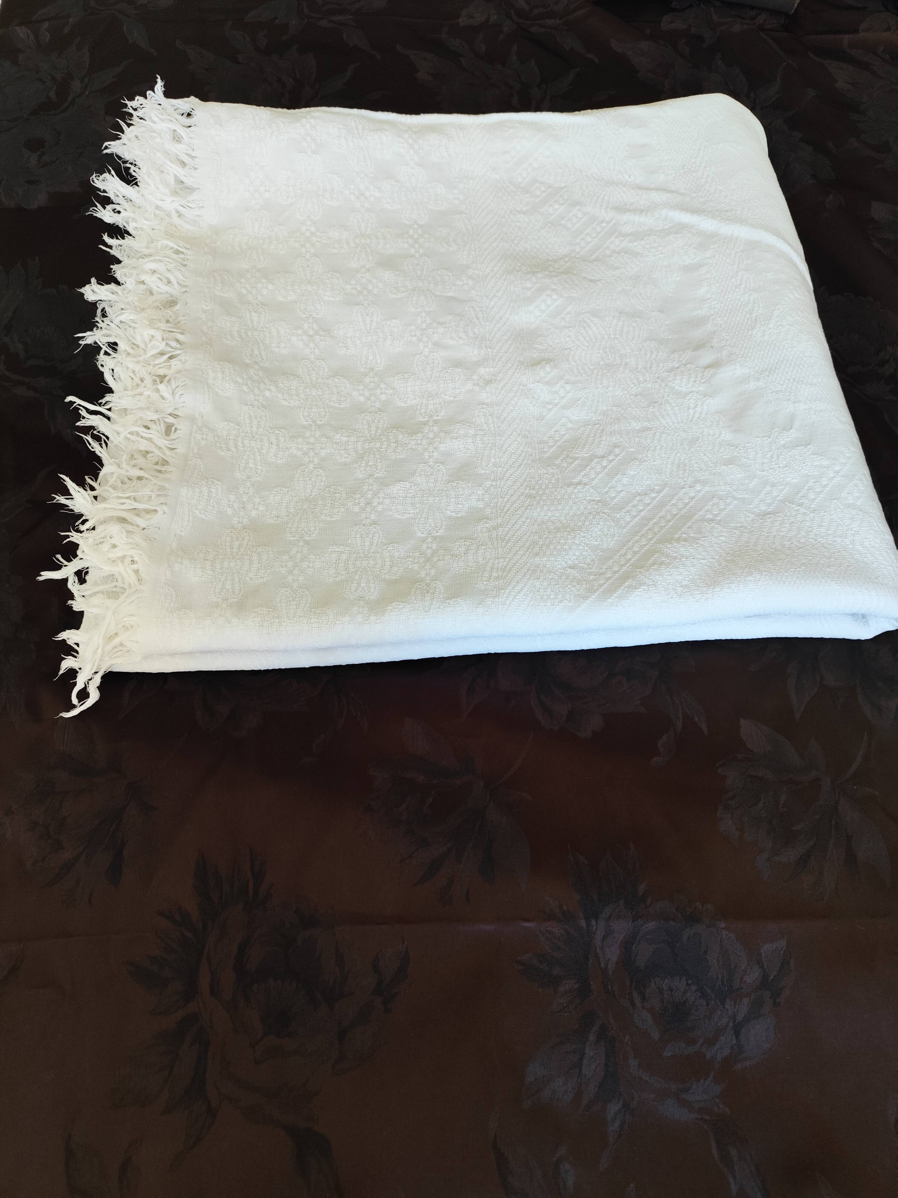 White woven cotton bedspread with fringes