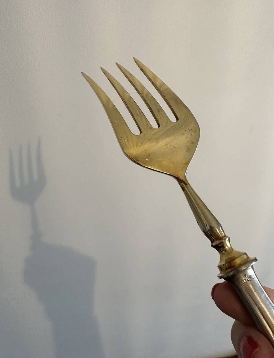 Engraved meat fork in silver and gold metal