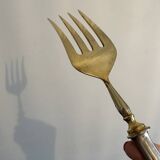 Engraved meat fork in silver and gold metal