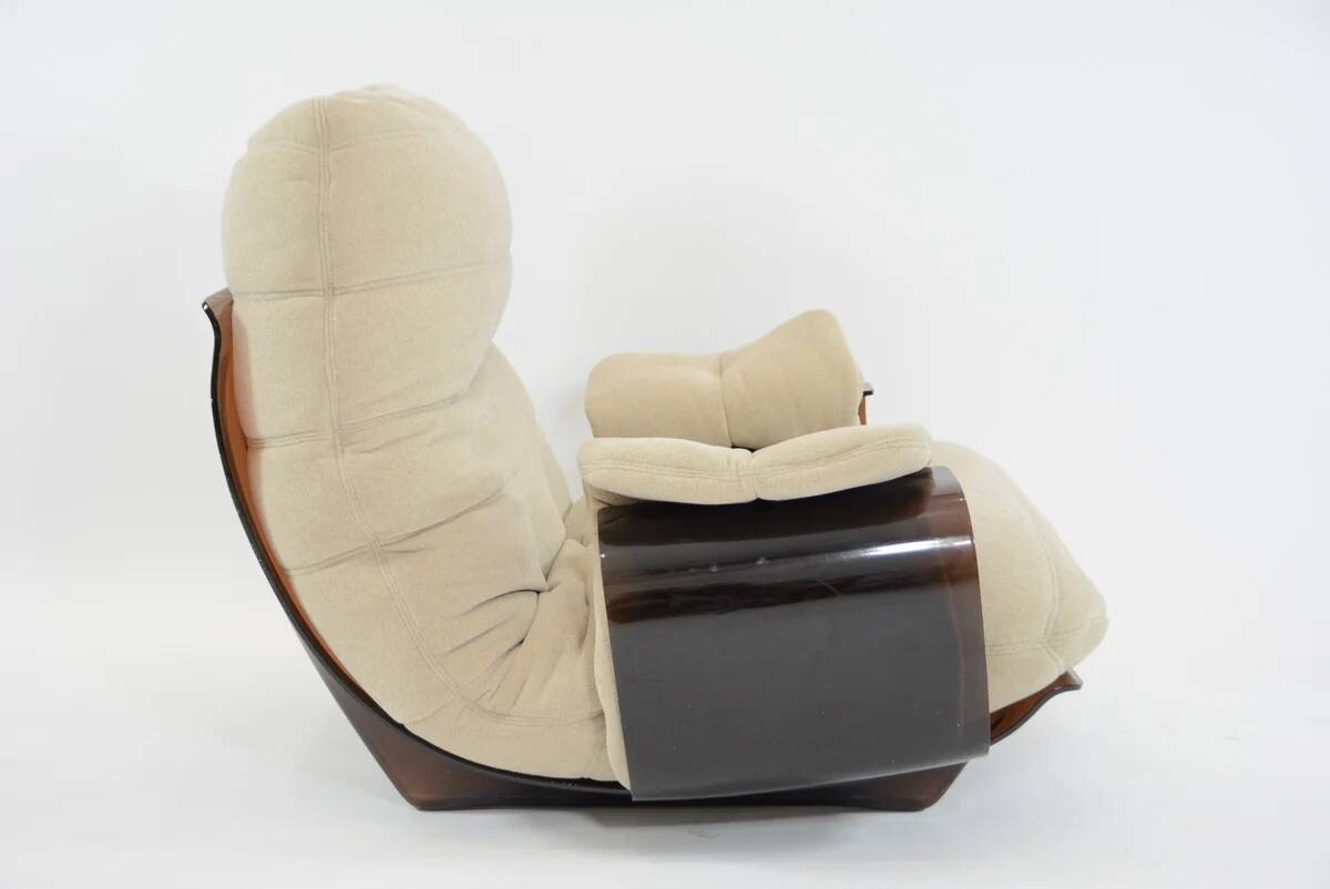Marsala armchair and its light beige Ligne Roset footrest.