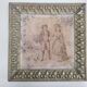 Antique tapestries framed in repoussé brass.