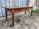 Antique chestnut farmhouse table with 3 drawers on the front.