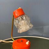 Small orange desk lamp with clear crystal glass shade