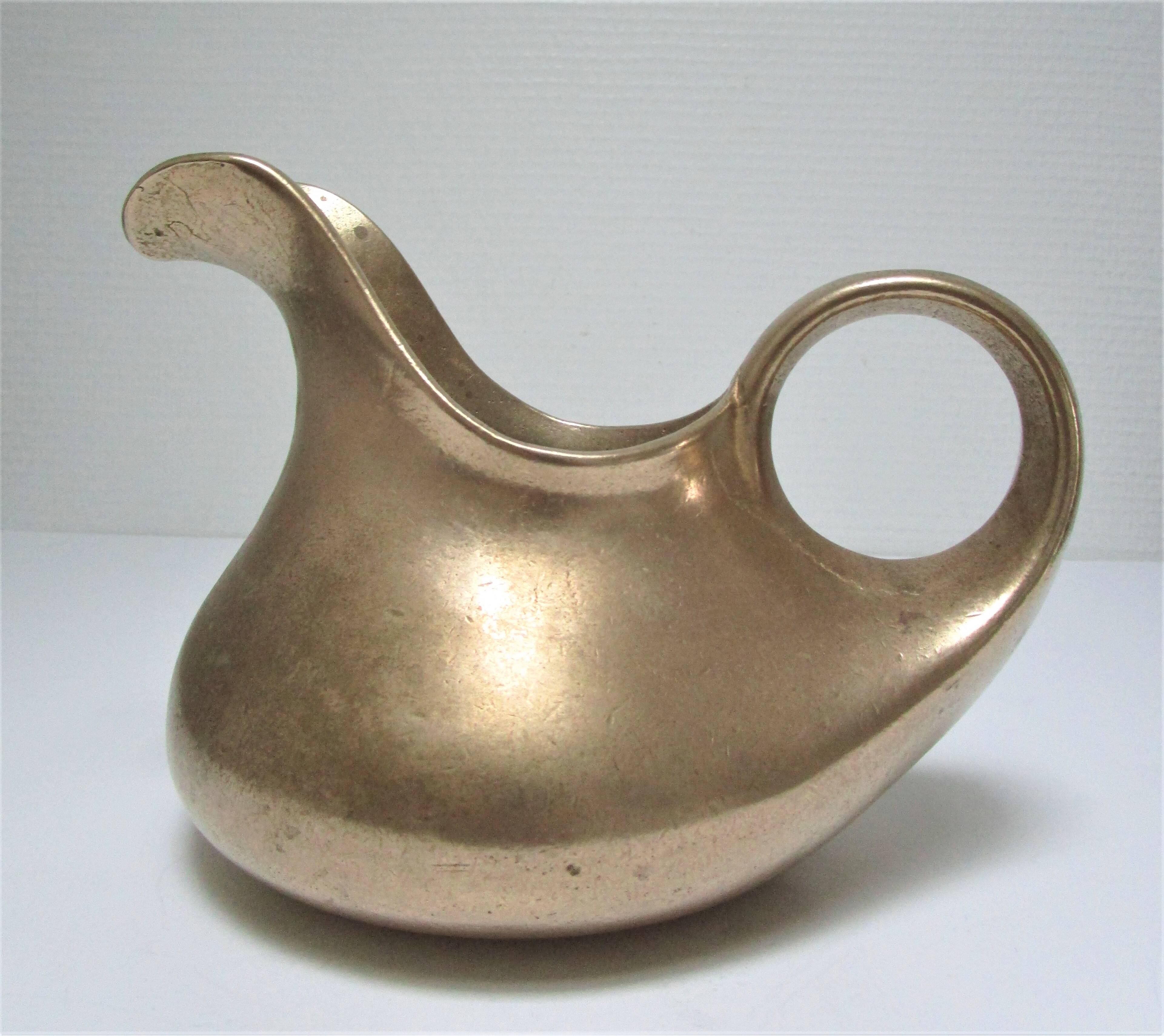 Stylized sculptural solid brass vase with handle