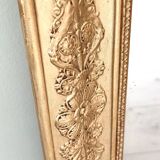 Wood and gilded stucco mirror, 19th century, 115 x 61.5 cm.