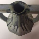 Ancient amphora vase in sand