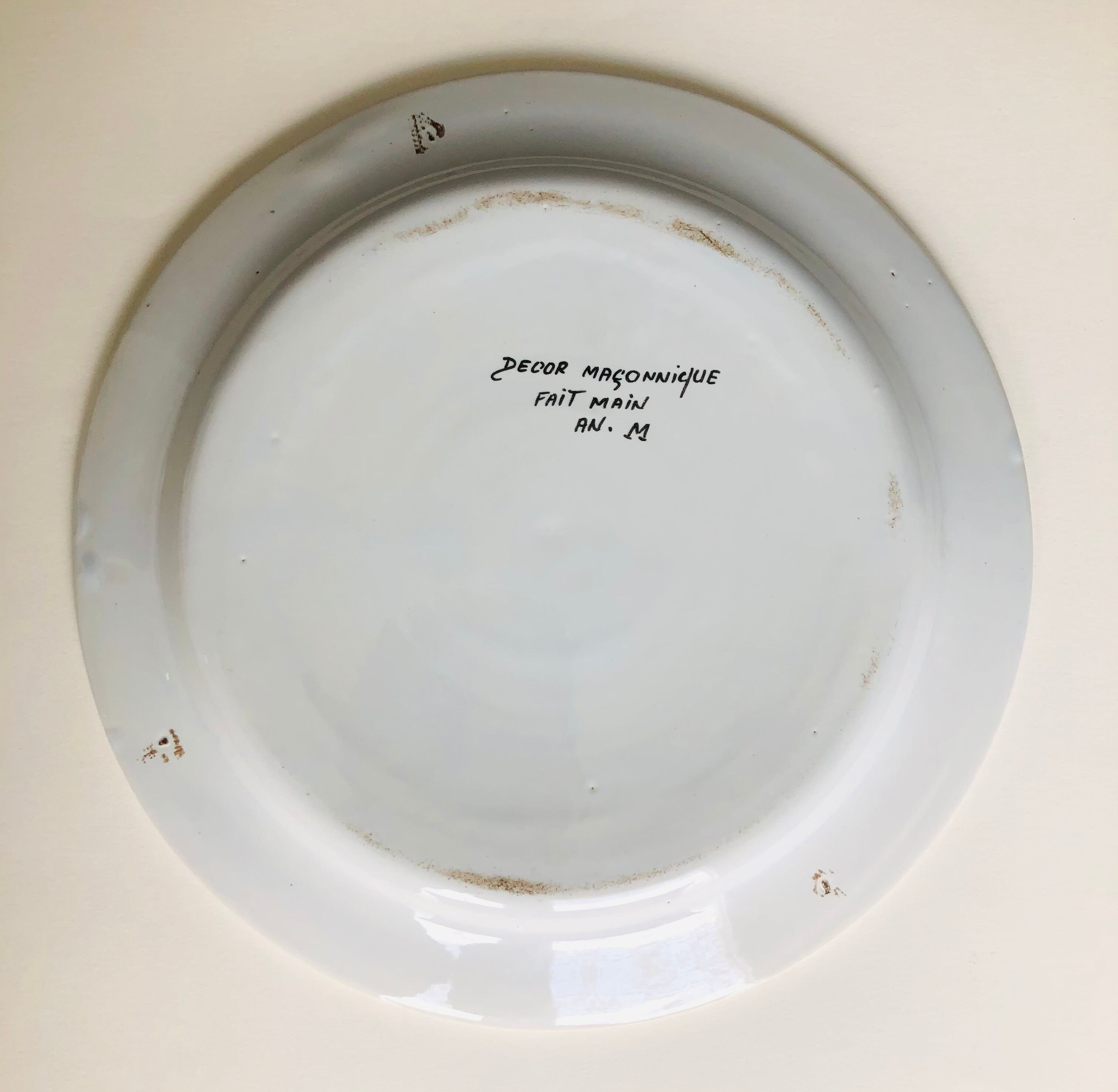 Old collection plate on The Masonic theme