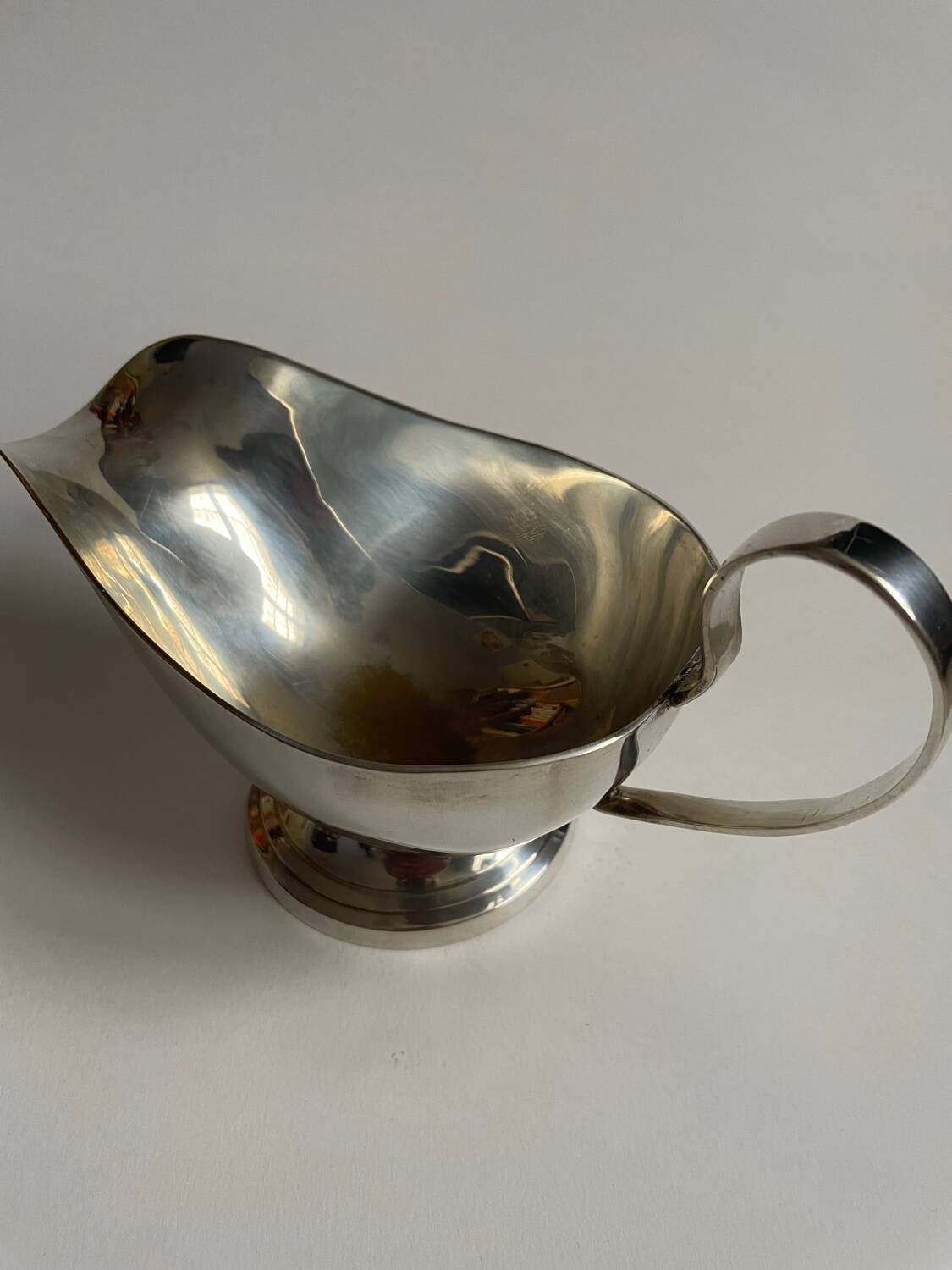 Silver metal sauce boat