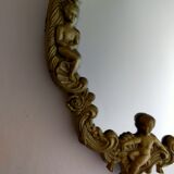 Gilded bronze mirror with angels and scrolls