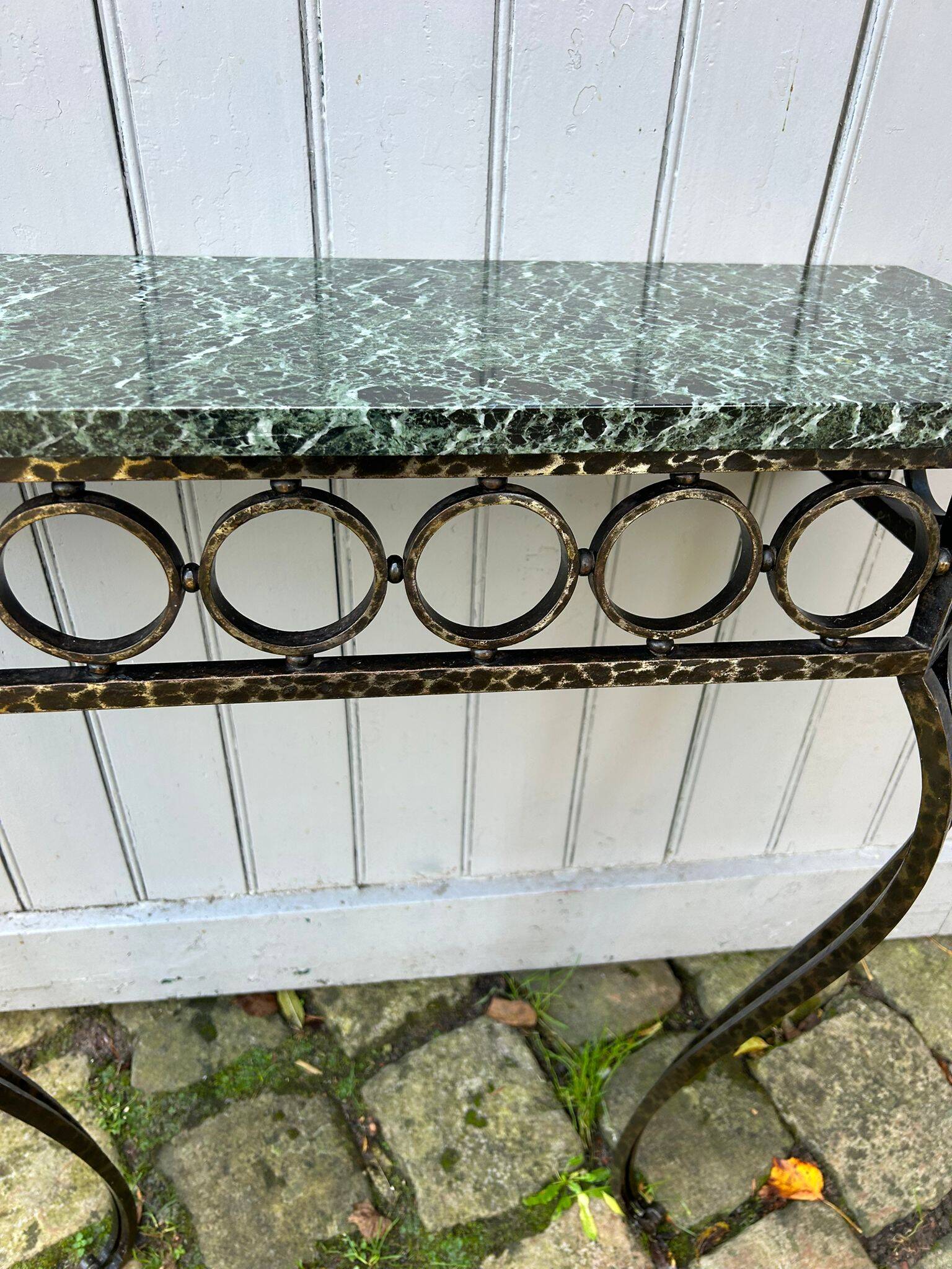 Console in wrought and hammered iron and green marble