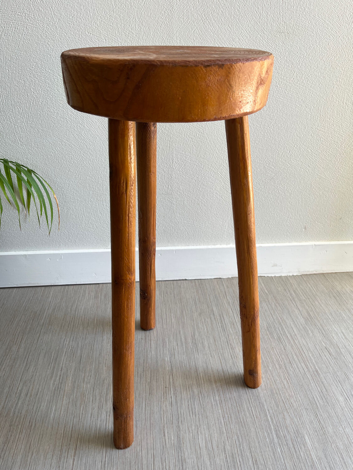Tripod stool in a brutalist style