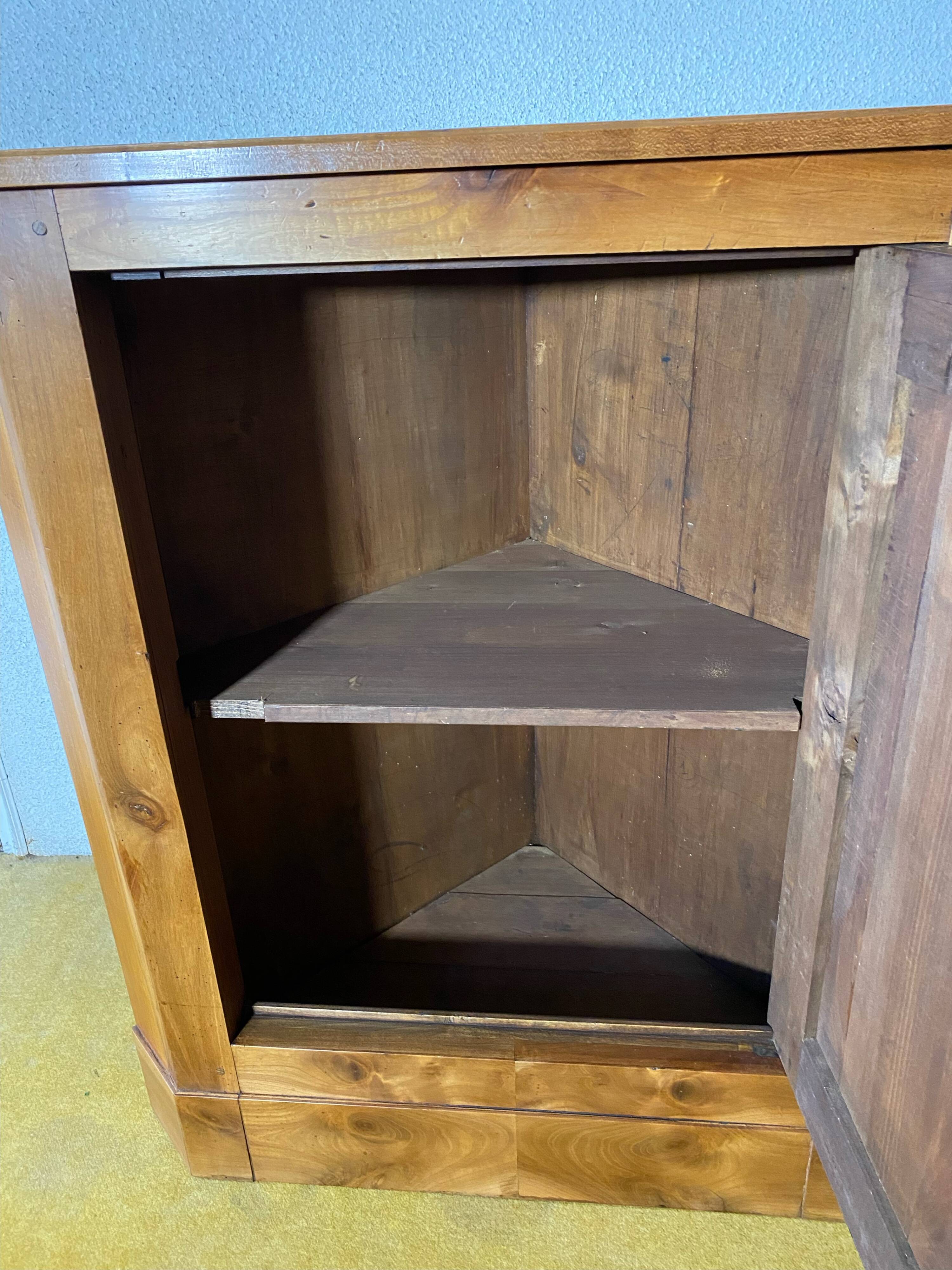 Cherry wood corner cupboard.