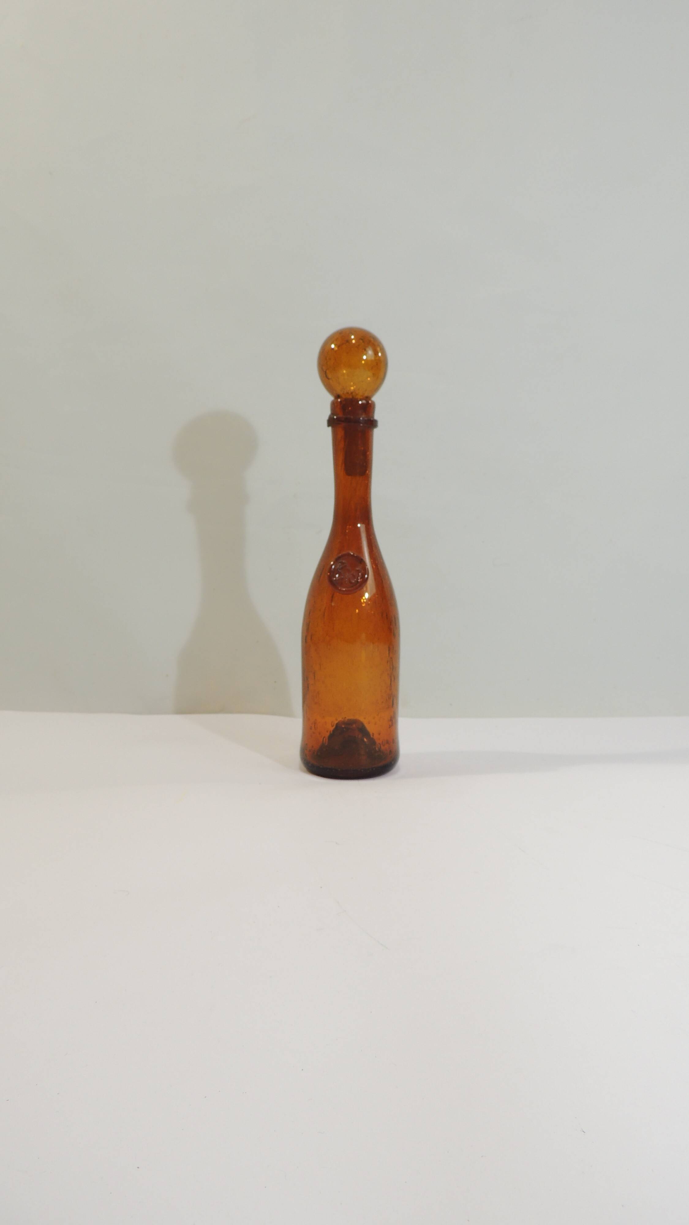 Amber bottle in bubbled blown glass, signed Biot – France, vintage 1970s