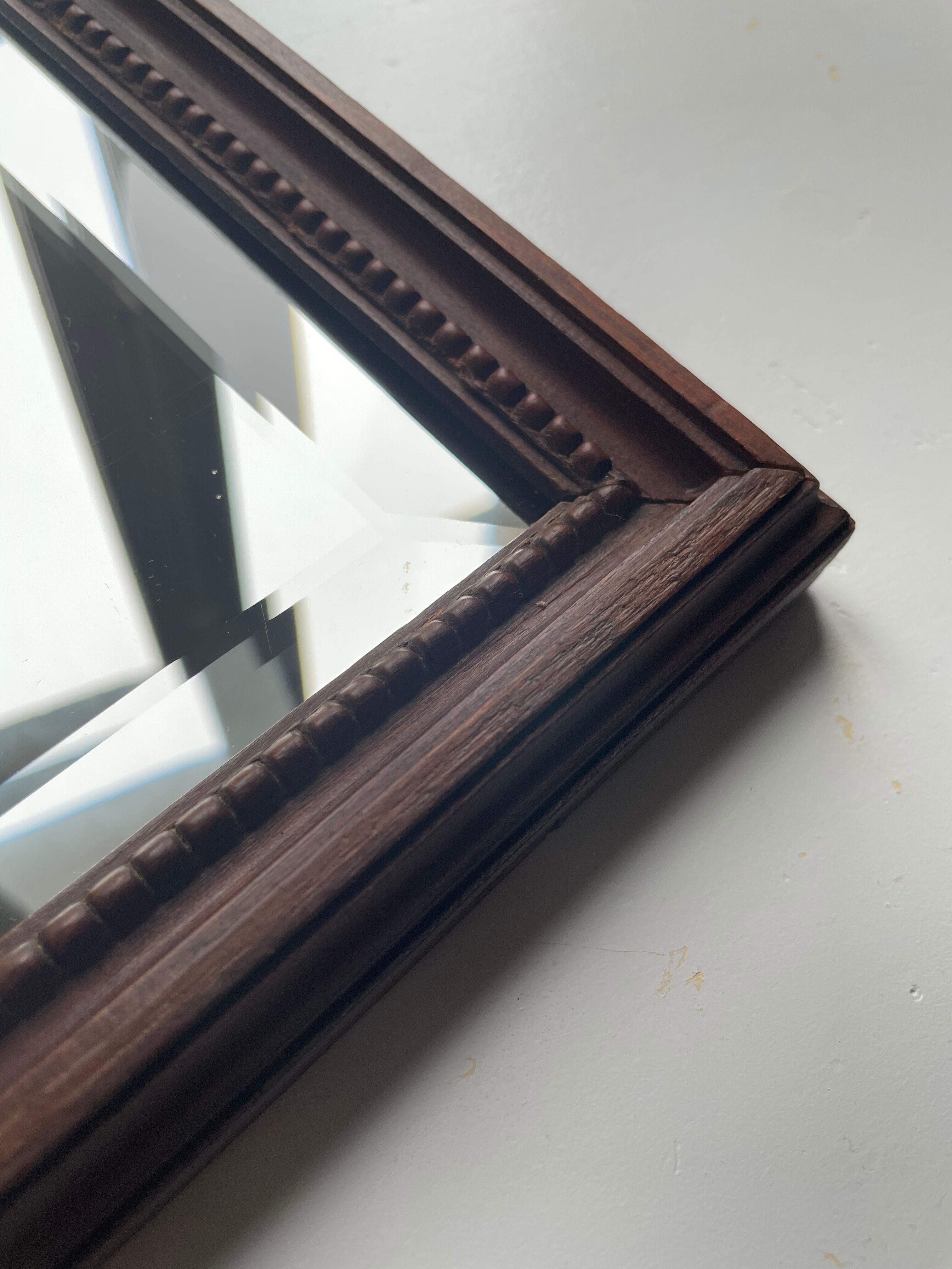 Bevelled mirror frame carved wood