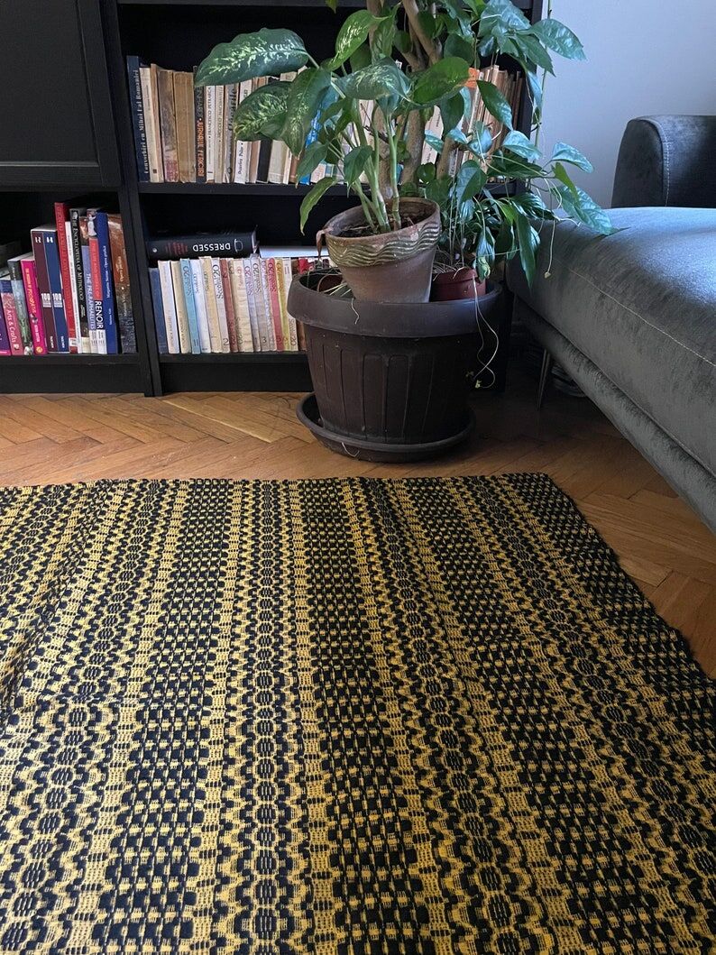 Romanian vintage carpet black design on a yellow background