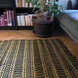 Romanian vintage carpet black design on a yellow background