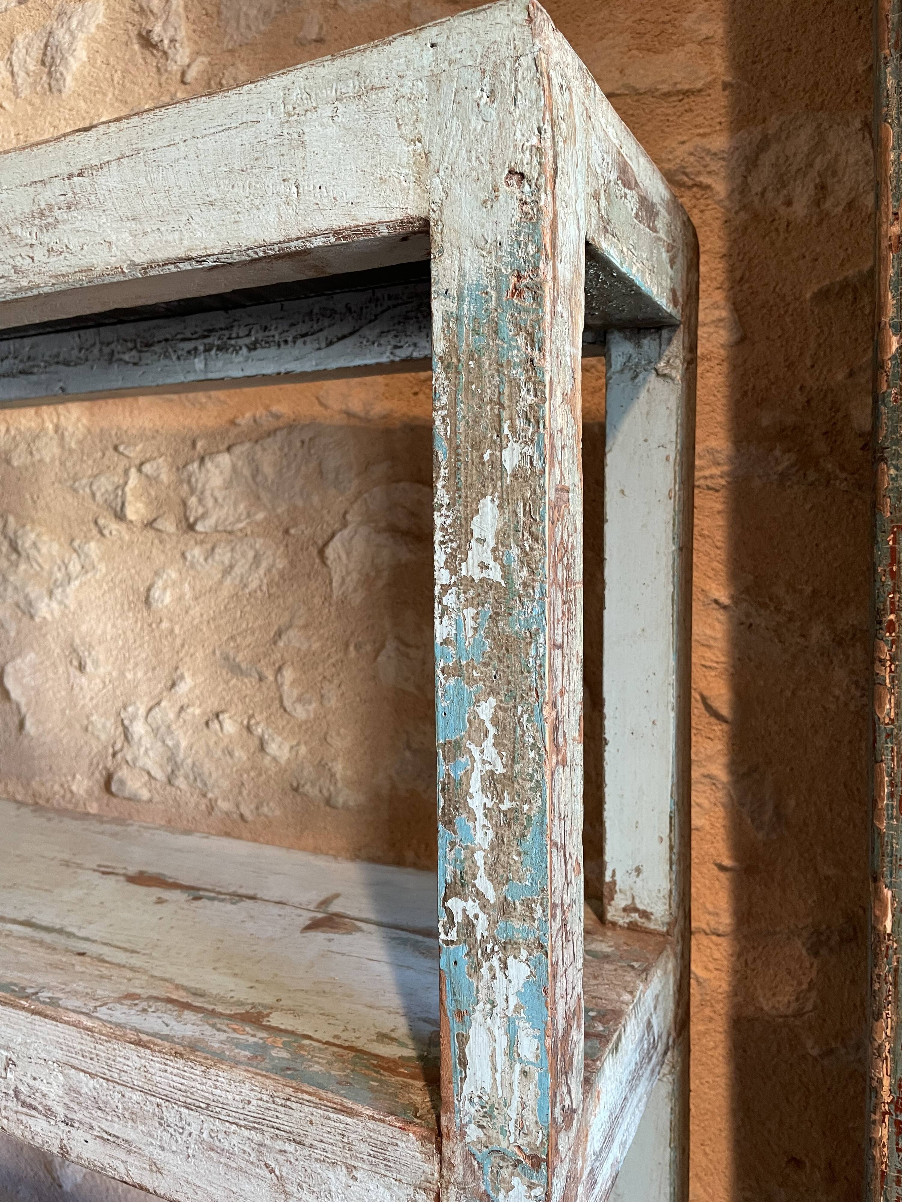 Blue lacquered teak shelves