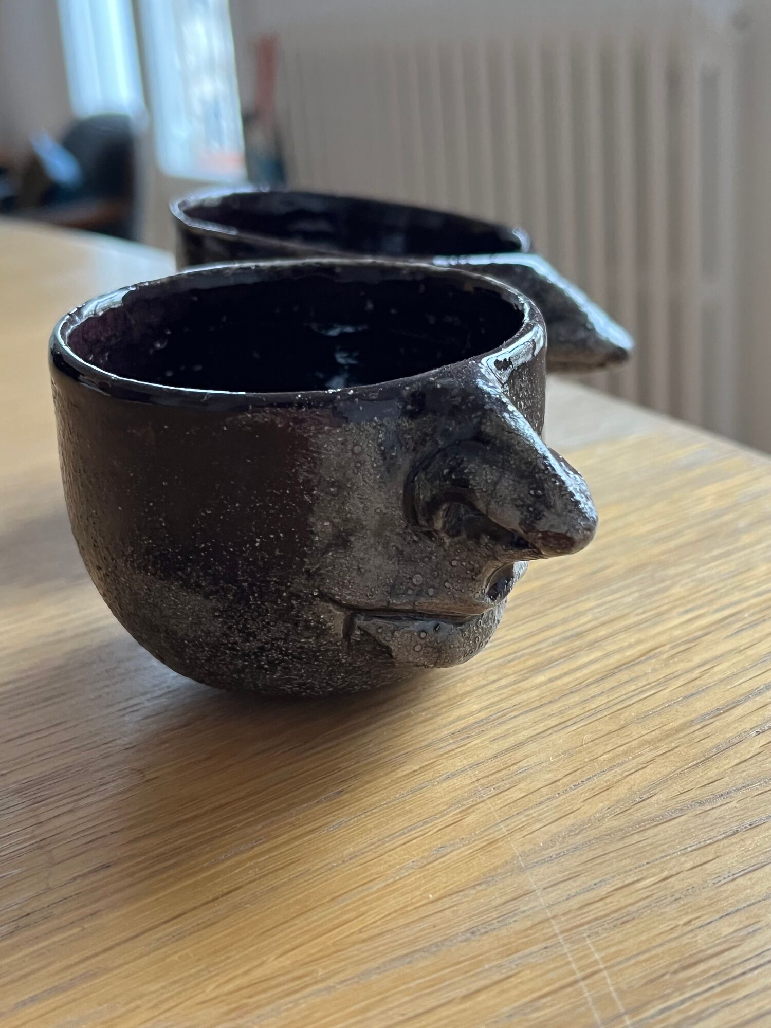 Ceramic coffee cups human nose and mouth