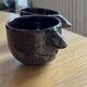 Ceramic coffee cups human nose and mouth