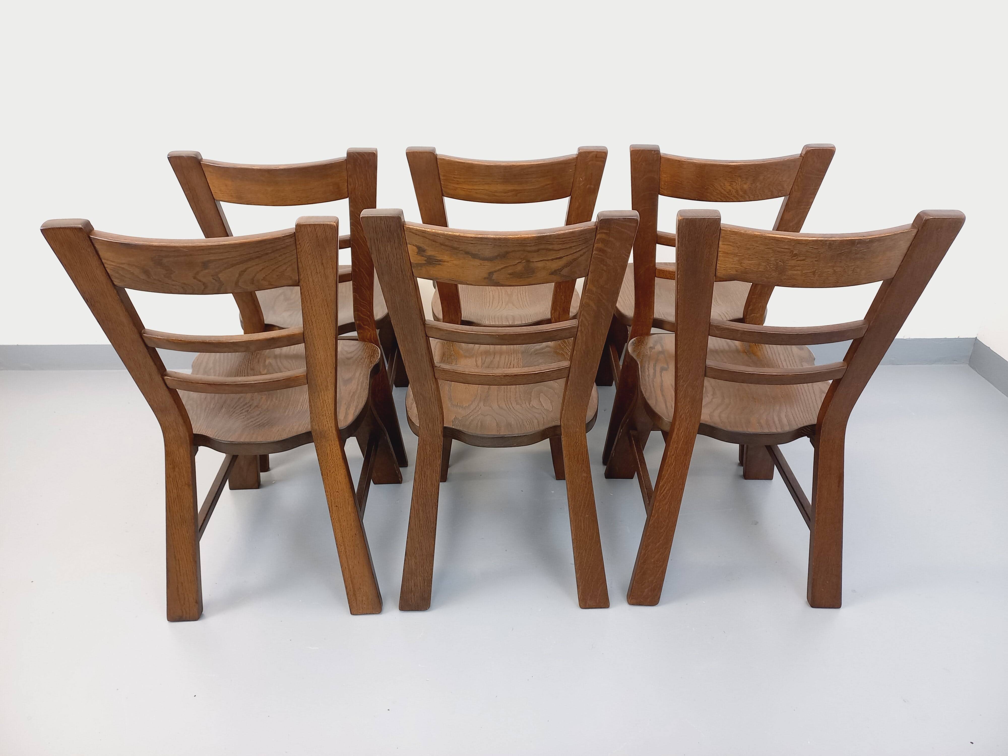 Set of 6 vintage brutalist oak chairs from the 1950s.