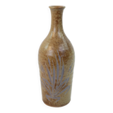 Brown ceramic/stoneware bottle with chiseled floral pattern