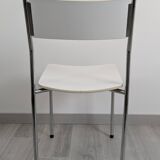 Modernist chair in chrome metal and white laminate, 1960s style.