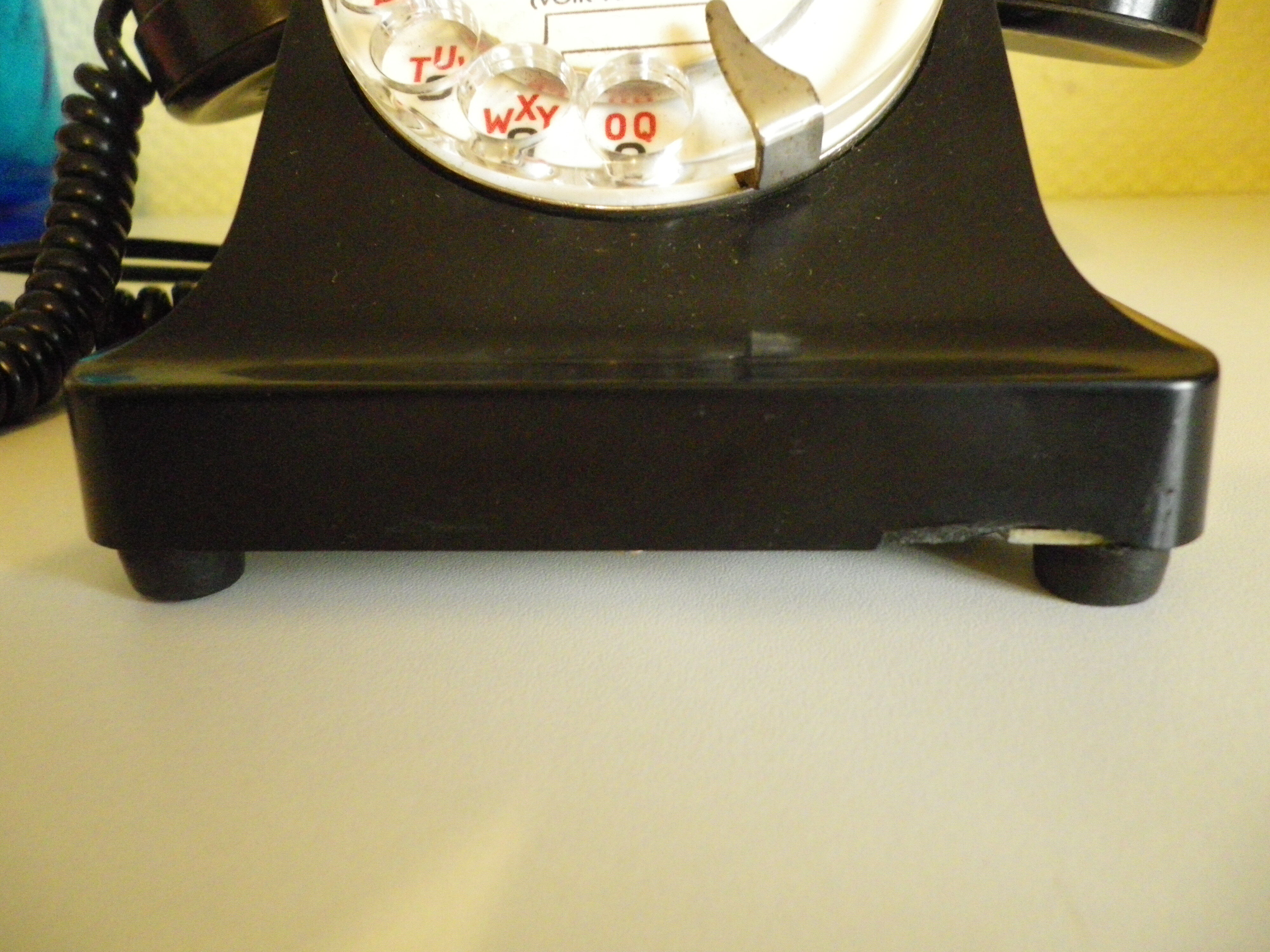 Black bakelite phone with earphone