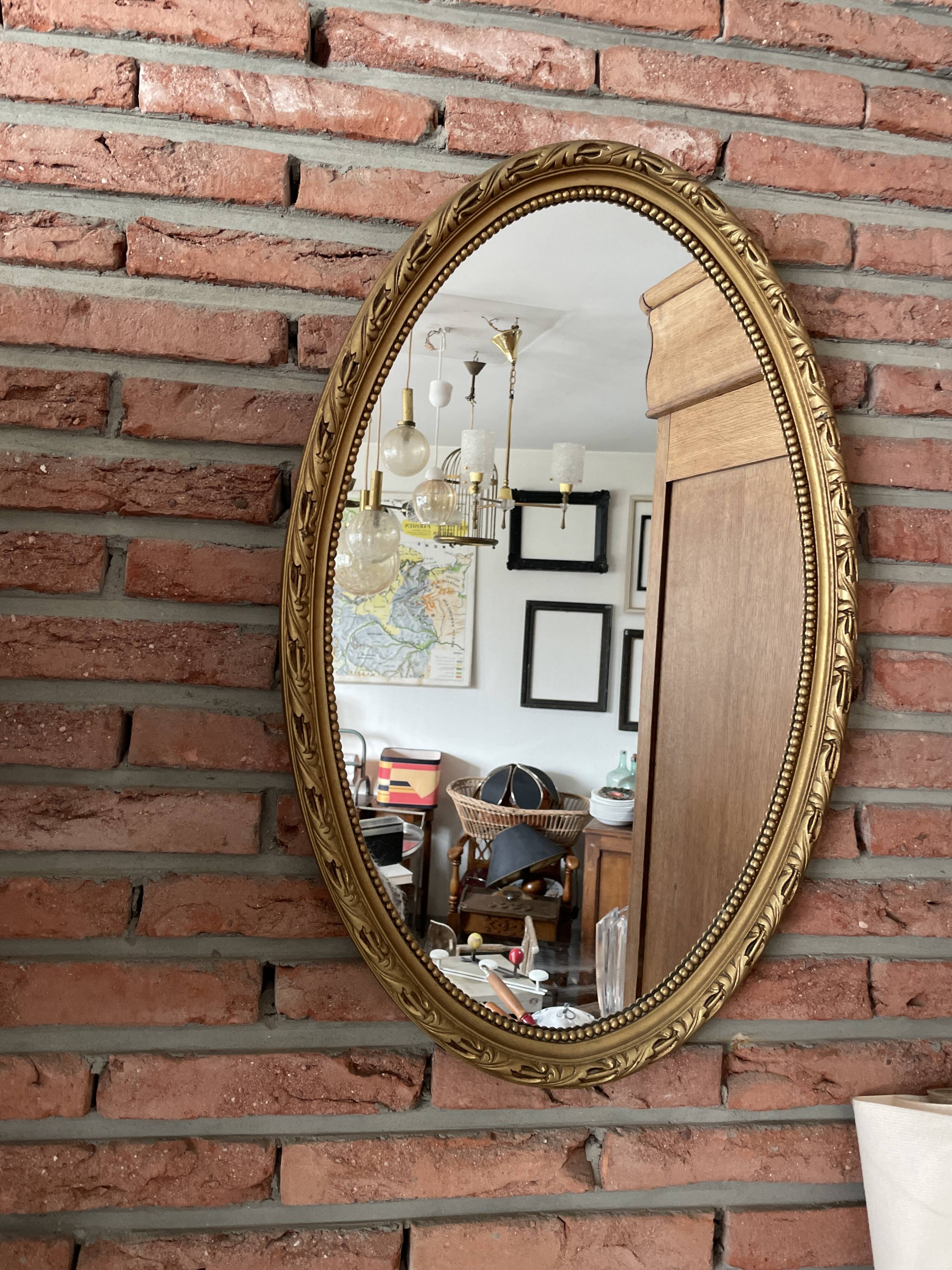Miroir doré ovale