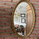 Miroir doré ovale