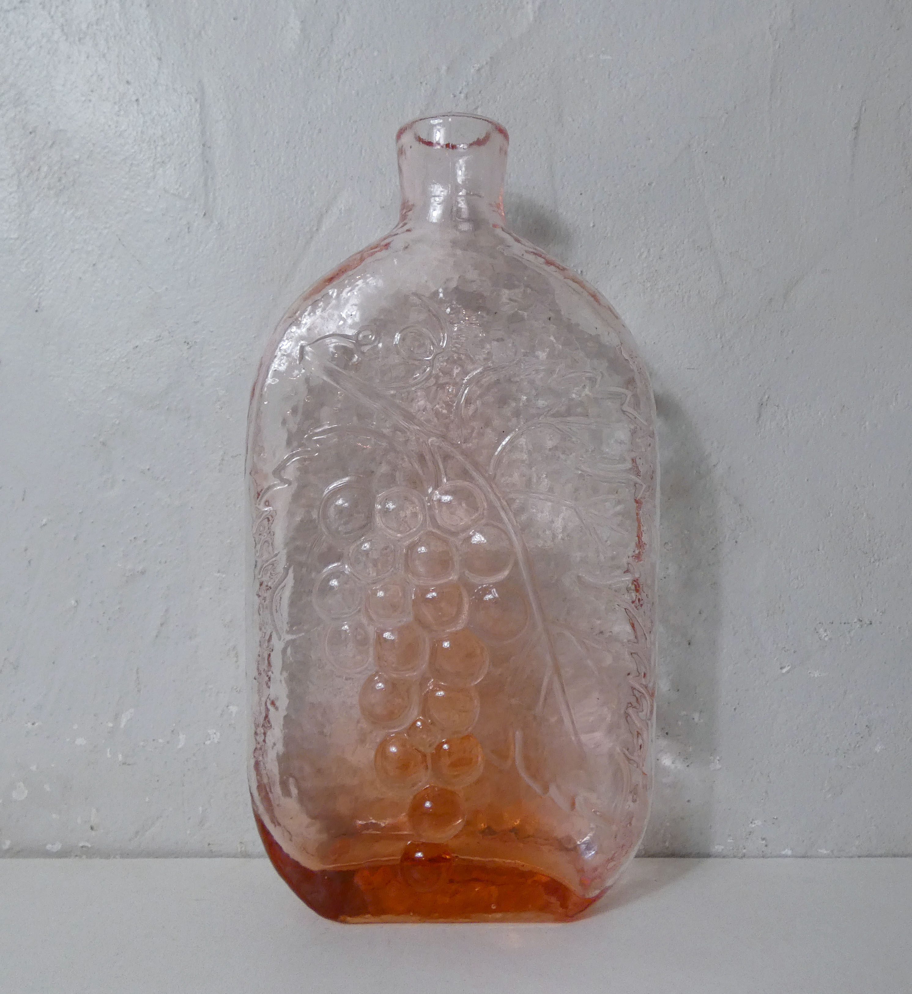 old carafe in orange pink glass