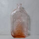 old carafe in orange pink glass