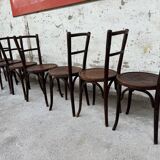 Série de 7 anciennes chaises bistrot Baumann bois courbé assise ronde