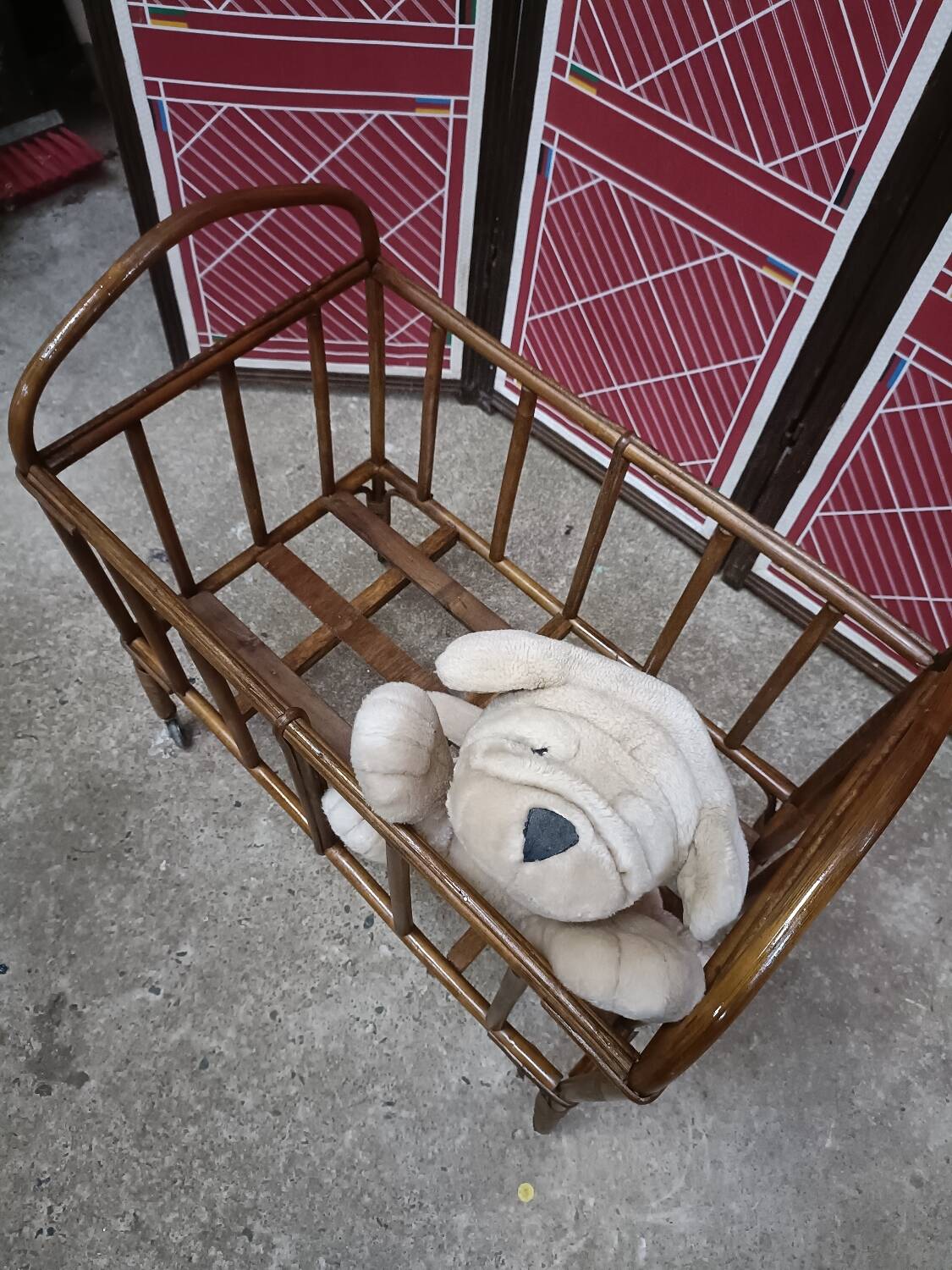 Old small bed or cradle for baby in vintage rattan
