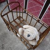 Old small bed or cradle for baby in vintage rattan