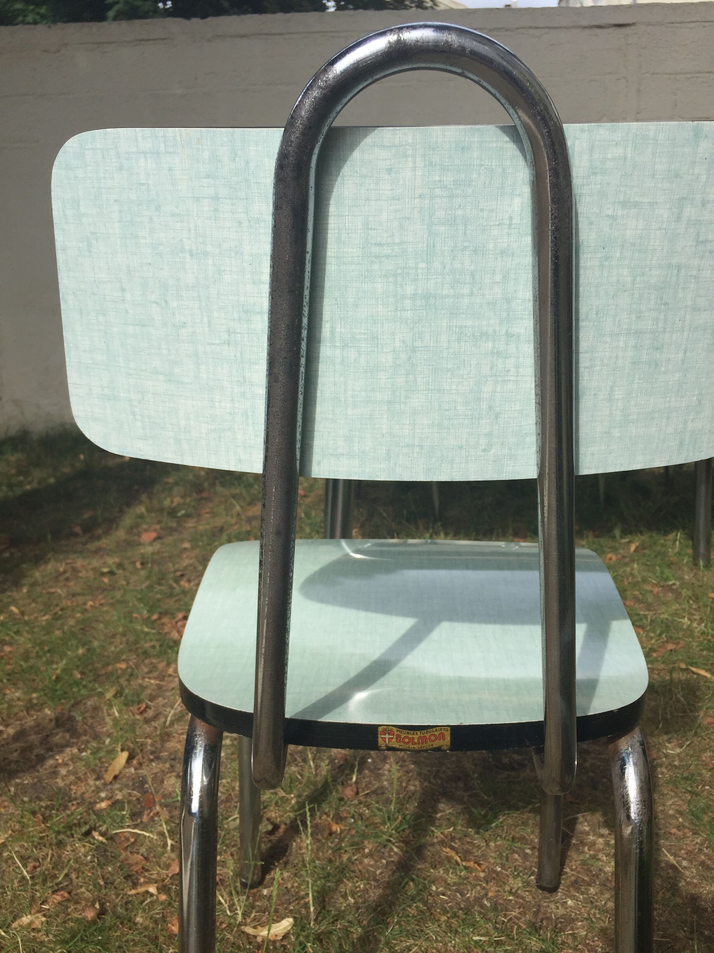 Table and 4 green water formica chairs 60's